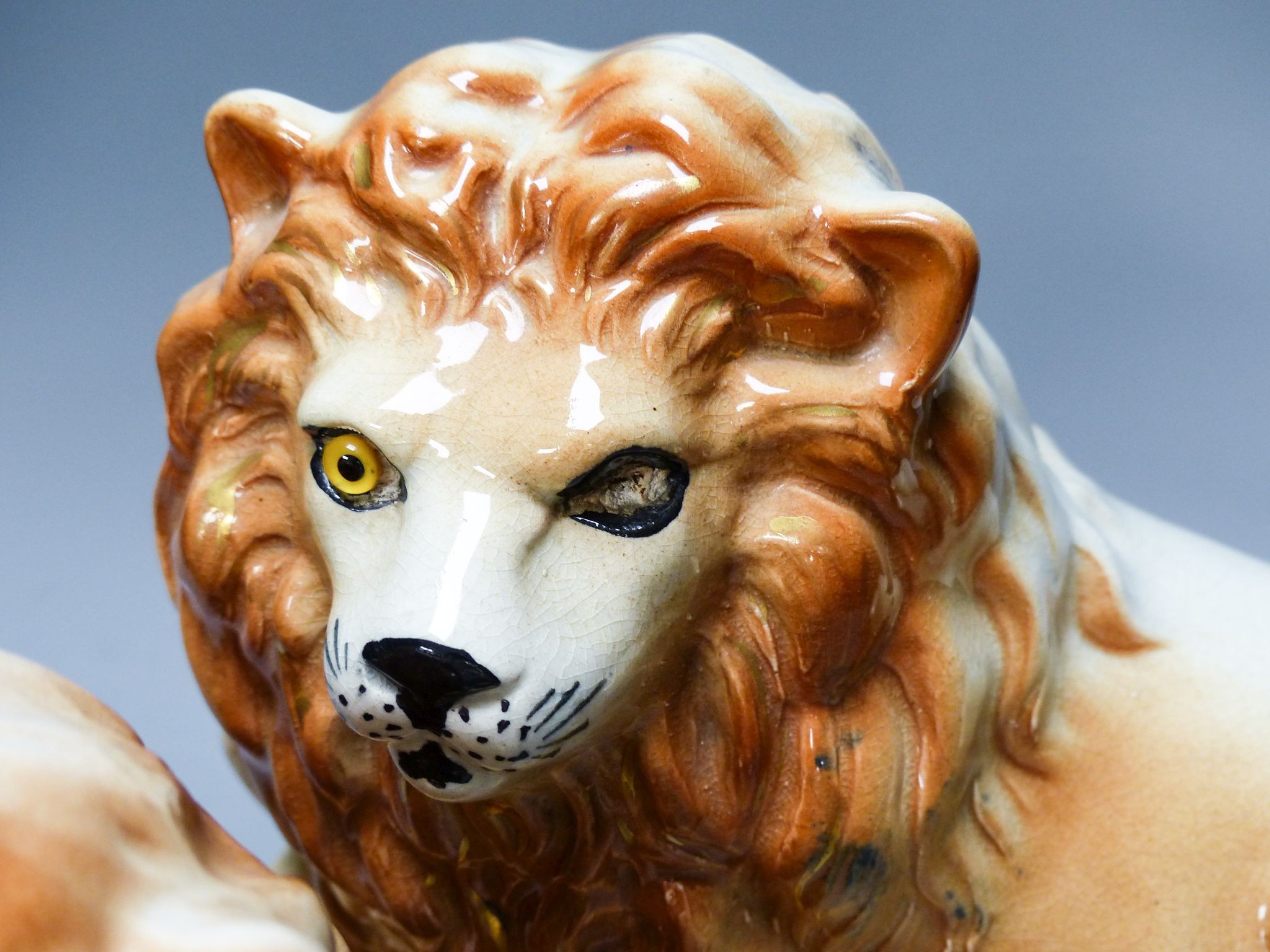 A pair of Staffordshire pottery 'lion' figures 30cm